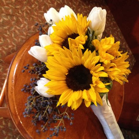 Maybe you would like to learn more about one of these? Bouquet with sunflowers, white tulips and privet berries ...