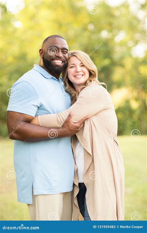 Loving Mixed Race Couple Hugging And Laughing Stock Photo Image Of