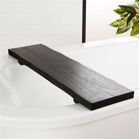 There's a reason people say that beauty lies in the every bathroom can get that spa feel by just having one of these there and it's sure to impress. Live Edge Charred Teak Bath Caddy