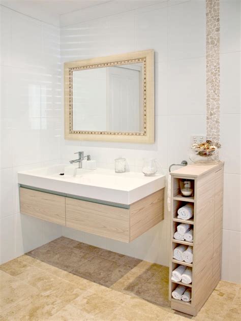Using two drapery tassels, secure two towels over towel rack and add towels inside. 15 Smart Bath Storage Ideas | HGTV