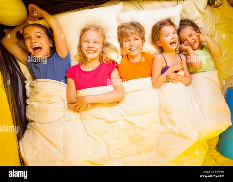 Young Girls Under Blanket Smile Hi Res Stock Photography And Images Alamy
