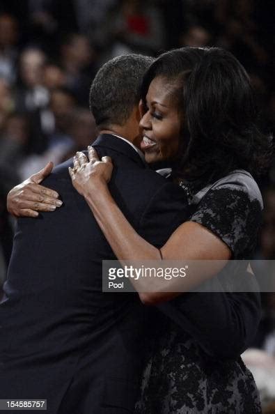 Us President Barack Obama Hugs First Lady Michelle Obama After The