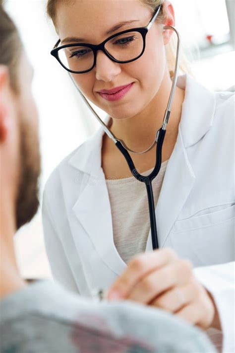 631 Female Doctor Checking Patient Heartbeat Using Stethoscope Stock