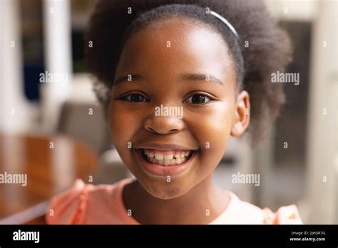 Image Of Happy African American Girl Looking At Camera Stock Photo Alamy