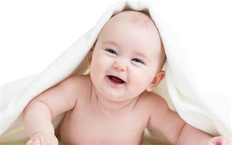 Cute Smiley Baby Boy Under White Towel Cloth In White Background Cute