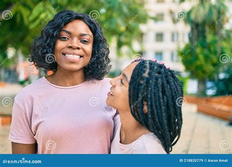 Beautiful African American Mother And Daughter Smiling Happy And