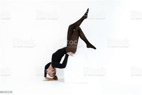 Fashion Model In Black Tights On The White Background Acrobatic Dancing Woman Posing Hot Blonde