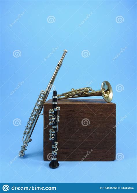 A Clarinet A Trumpet A Transverse Flute And A Wooden Block Stock