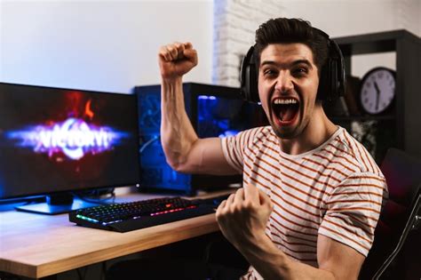 Premium Photo Portrait Of Caucasian Gamer Guy Screaming And Rejoicing