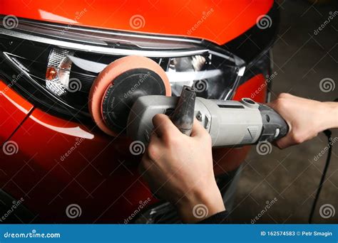 Mechanic S Hands Are Polishing Headlight Car By Polishing Machine