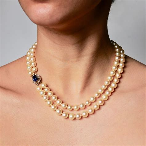 A Graduated Cultured Pearl Double String Necklace With Rose White Diamond Ceylon Unheated