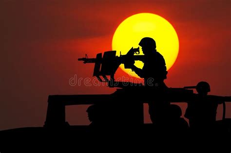 Soldier Preparing To Aim Machine Gun Mounted On The Roof Of Humvee
