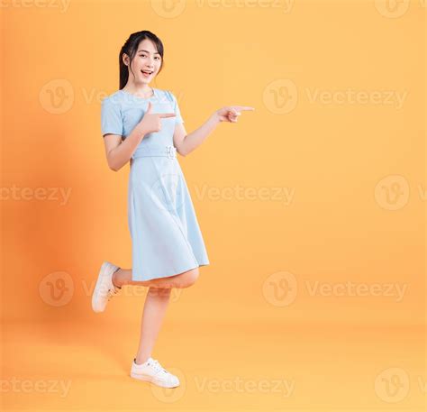 Young Asian Woman Wearing Dress On Background 21393609 Stock Photo At