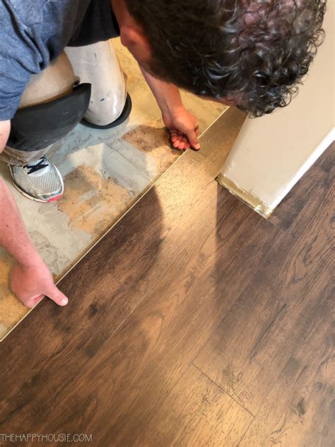 You will have to look at the transition strips available, many have separate pieces that can be used to accommodate different heights How to Install Vinyl Plank Over Tile Floors | The Happy Housie