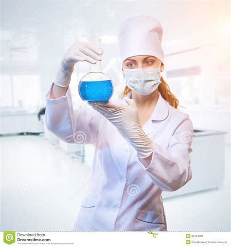 Laboratory Assistant In Rubber Gloves Working With A Modern