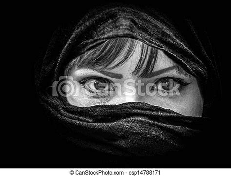 portrait of beautiful arab woman with brown eyes wearing black scarf in black and white canstock
