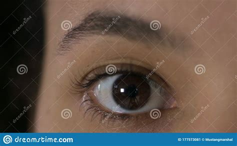 The Close Up Of African American Woman Eye Blinking At Camera Stock