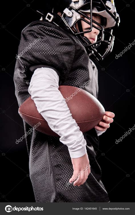 Boy Playing American Football — Stock Photo © Arturverkhovetskiy 142451645