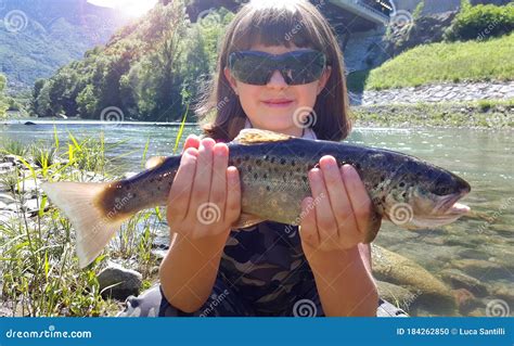 Young Girl Is Fishing Trout In The River Stock Photo Image Of