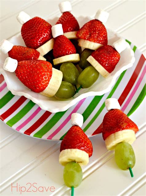 Create a healthy fruit platter for christmas in the shape of a christmas tree using an apple, grapes, raspberries, blackberries, and graham crackers! Grinch Fruit Kabobs (Easy Holiday Snack) | Holiday ...