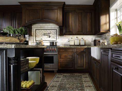 These traditional kitchen cabinets feature details like decorative insets, crown moulding, legs, and feet that create a cohesive design with classic style. Traditional Cherry Wood Kitchen Cabinets | DeWils in 2020 ...