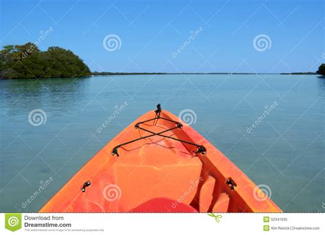 Orange Kayak On A Desert Island Beach Stock Photo