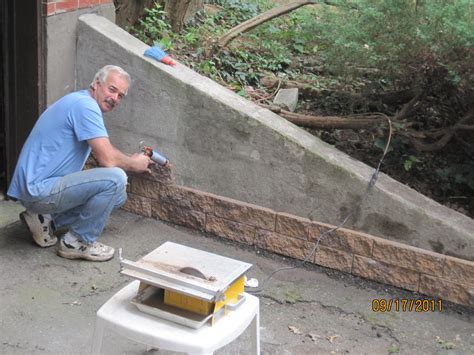 Great way to cover up this unsitely cement wall and recycle the extra