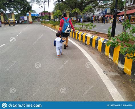 Indian Mother Or Girl And Child Walking Near The Yellow