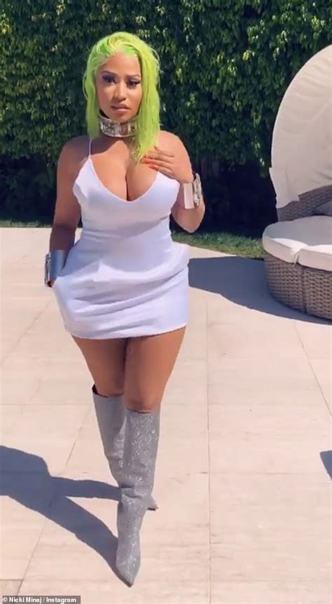 nicki minaj flaunts her voluptuous in a plunging white mini dress and poses with rumored husband