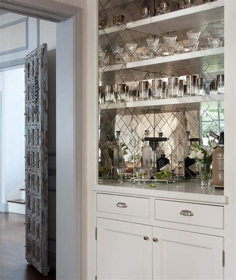 Stunning Bar Boasts White Bar Shelves Mounted On Antiqued Mirrored