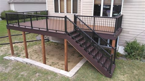 Trex enhanced naturals decking in coastal bluff, redirail 100 series aluminum railing in black, timbertech riser lights in bronze, as. Custom Deck in Plymouth | Lake Country Deck & Fence