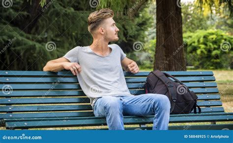 Handsome Blond Young Man Sitting On Park Bench Stock Image Image Of