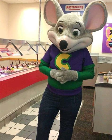 A Person Wearing A Mouse Costume In A Store