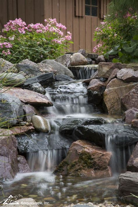 Backyard Waterfalls Can Accomplish A Variety Of Landscaping Needs