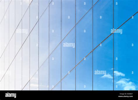 Clean Blue Mirror Glass Window Background In Modern Building Stock
