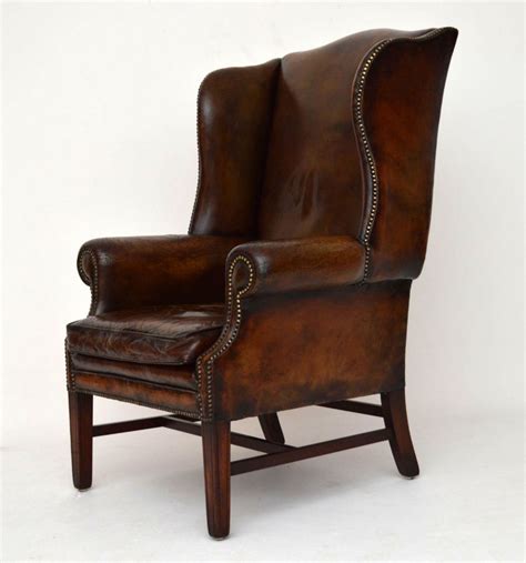 The back with shaped top and shaped wings running into splayed arms. Antique Distressed Leather Wing Back Armchair | 288998 ...