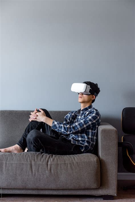 Young Man Wearing Virtual Reality Headset By Stocksy Contributor