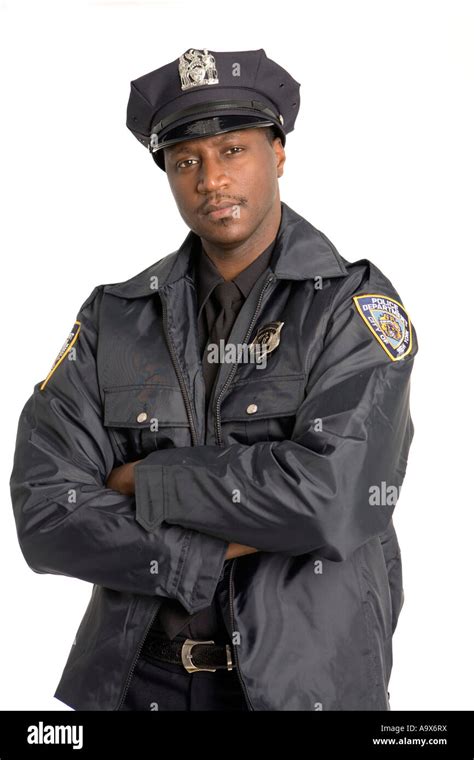 Young Black Police Officer Looking At The Camera In The Usa Stock Photo