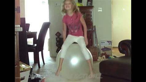 girl bouncing on a big gym ball with feet almost not touch the floor youtube