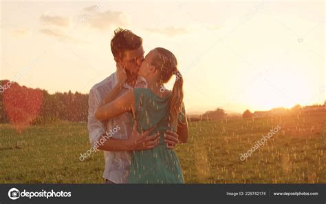 Lens Flare Close Cheerful Young Couple Kisses Soothing Rain Romantic