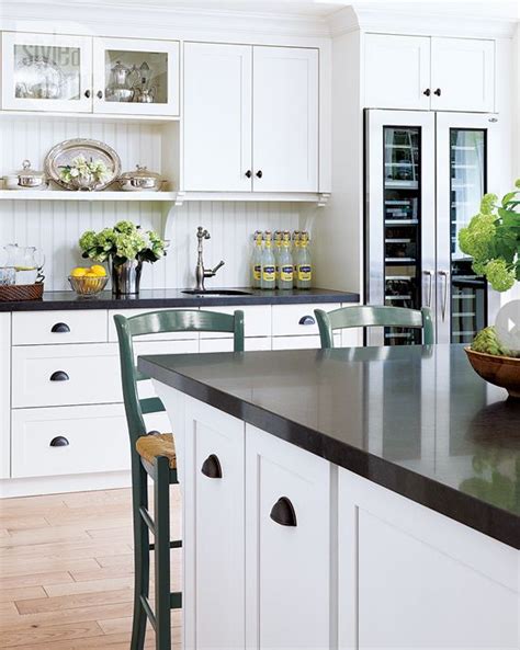 Hard wearing, they are an extremely practical choice for kitchen worktops since they hide the dirt, conceal cracks and are not easily… Two Classic White Kitchens To Copy
