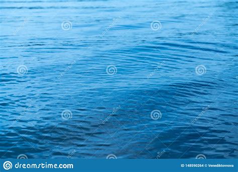 Abstract Background Texture Surface Of Blue Water With Waves Stock