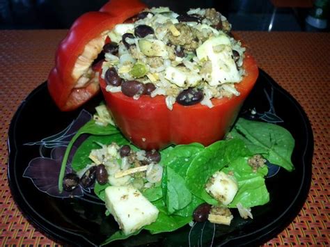 Stuffed Red Peppers Wuth Squash Black Beans Pepitas And Brown Rice