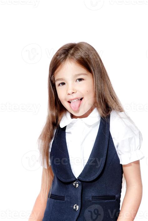 Portrait Of Cute Smiling Schoolgirl Shows Tongue Isolated On White Background 12045040 Stock