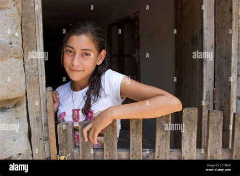 Beautiful Young Girl In Rural House In Honduras With A Peaceful Smile