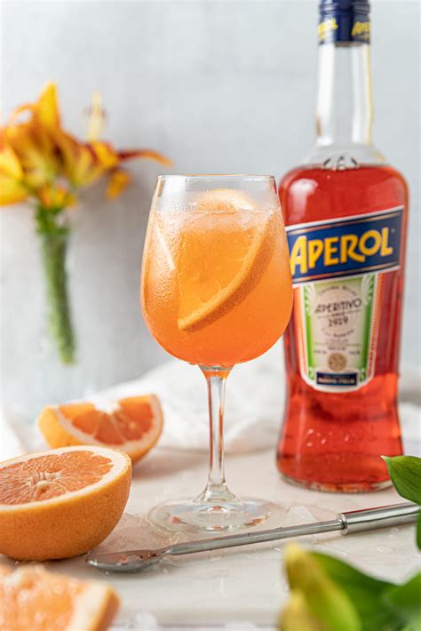 Its orange is unmistakable, a vibrant color that lights up your toasts and adds extra joy to the moment. Grapefruit Aperol Spritz - The Boozy Ginger