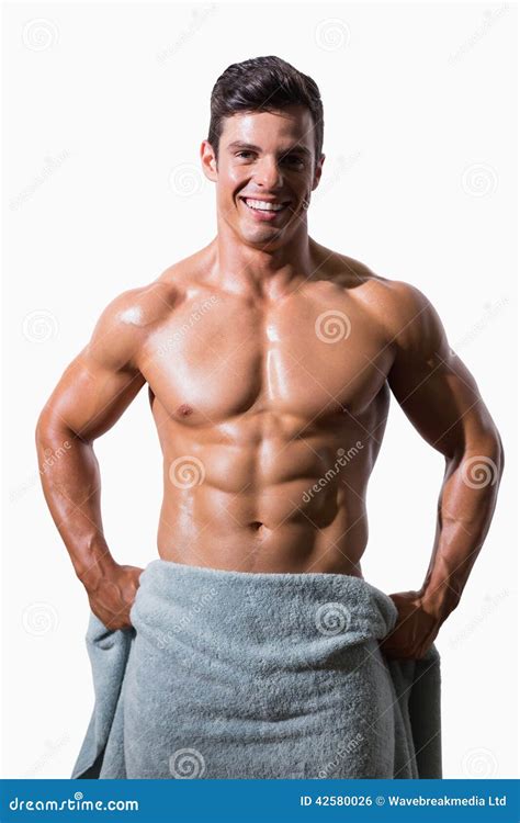 Portrait Of A Smiling Shirtless Muscular Man Wrapped In Towel Stock