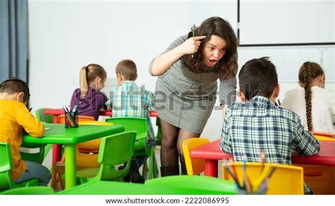 Female Teacher Scolding Guilty Student Elementary Stock Photo