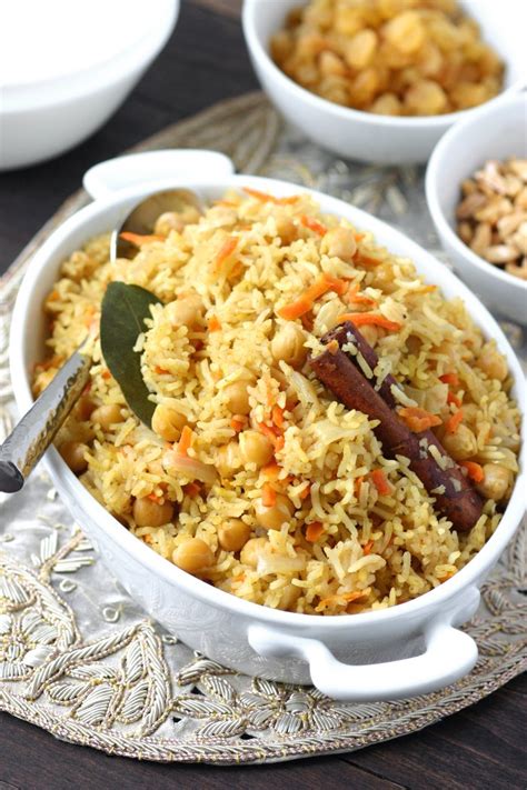 Add water or broth and remaining seasonings, but not the raisins or almonds. Bukhari Rice | Lands & Flavors