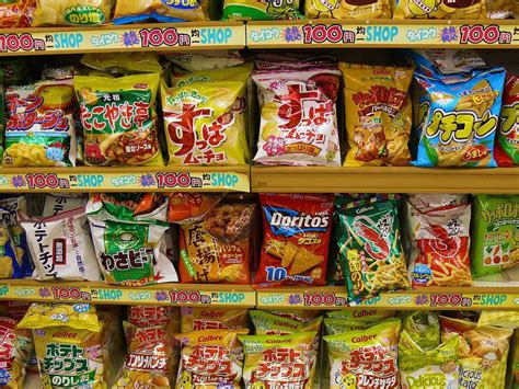 Many Different Types Of Snacks On Display In A Store